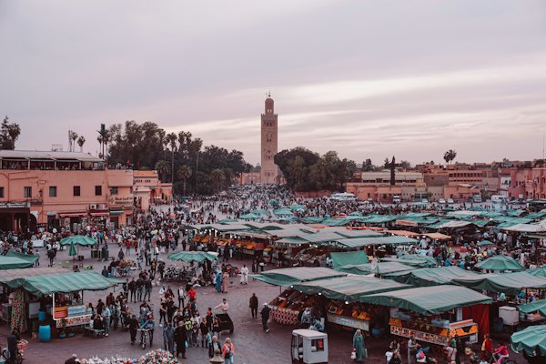 People walking on street near buildings during daytime — Marrakech, Morocco