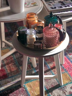 A vibrant display of traditional jhaari ji and aarsi arranged on a wooden table with soft natural light.