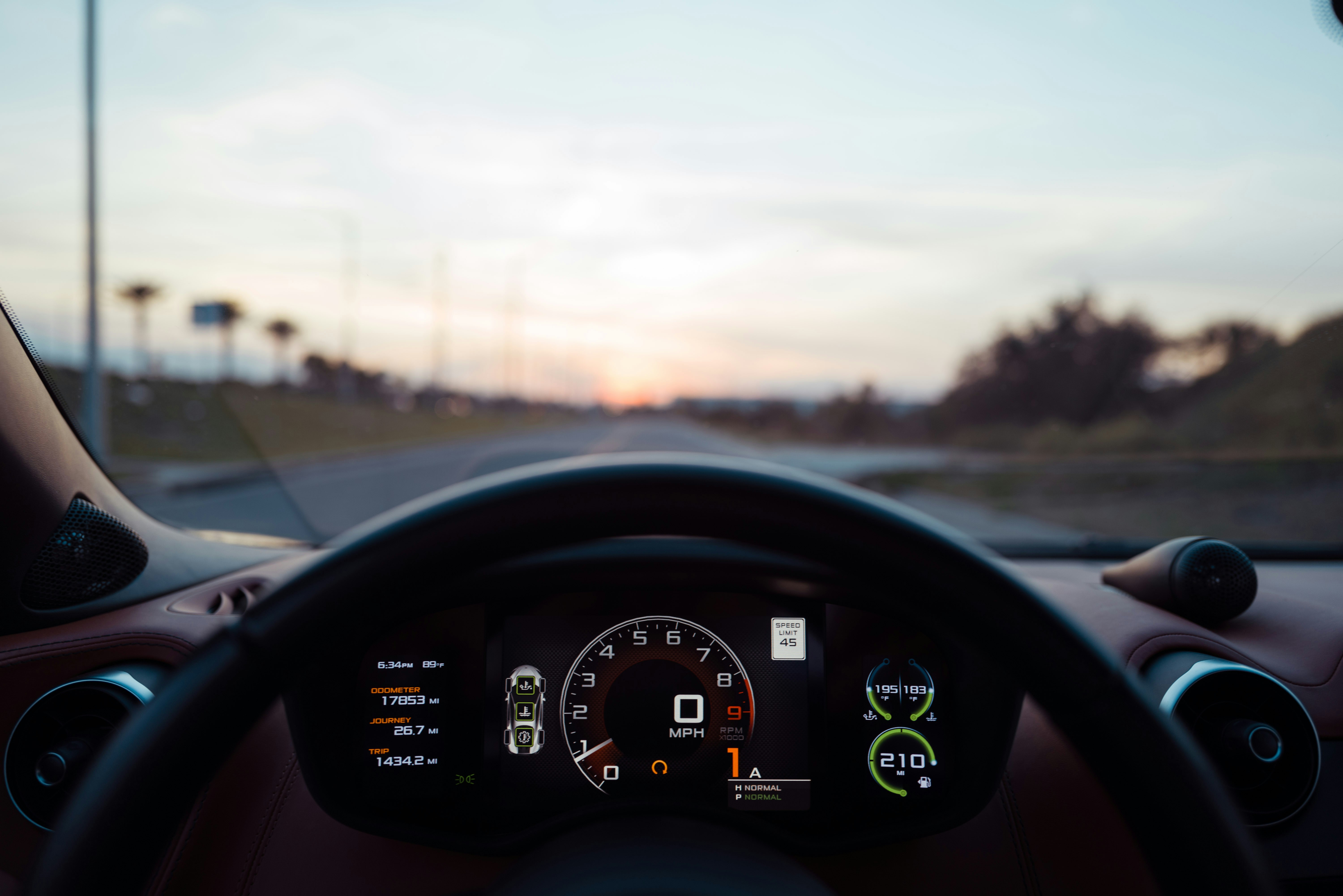 dashboard of a modern electric vehicle showing dual screens and minimalist design