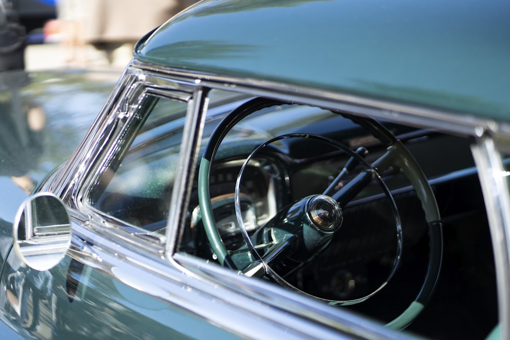 blue car with black wheel