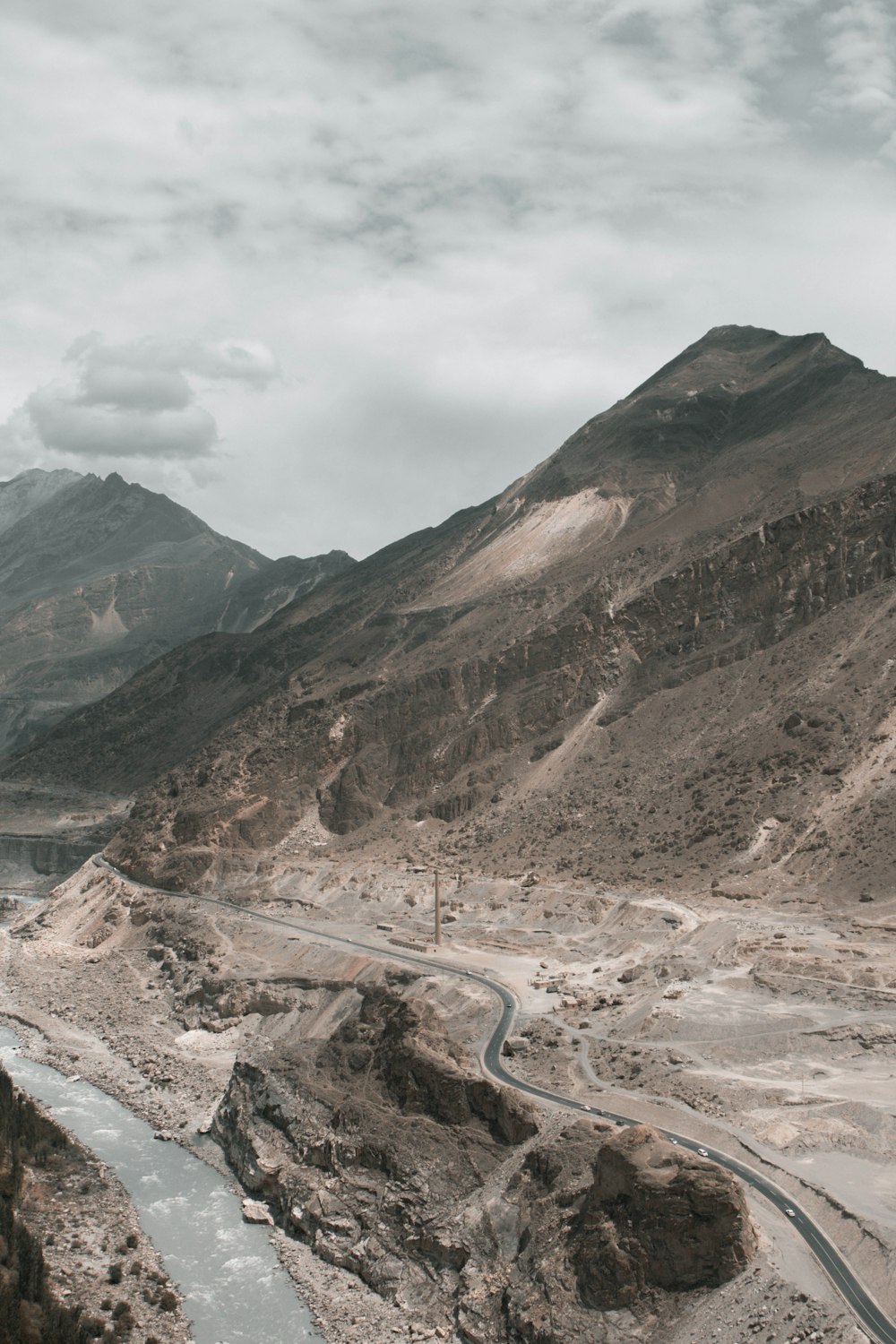 brown and gray mountains under white clouds during daytime