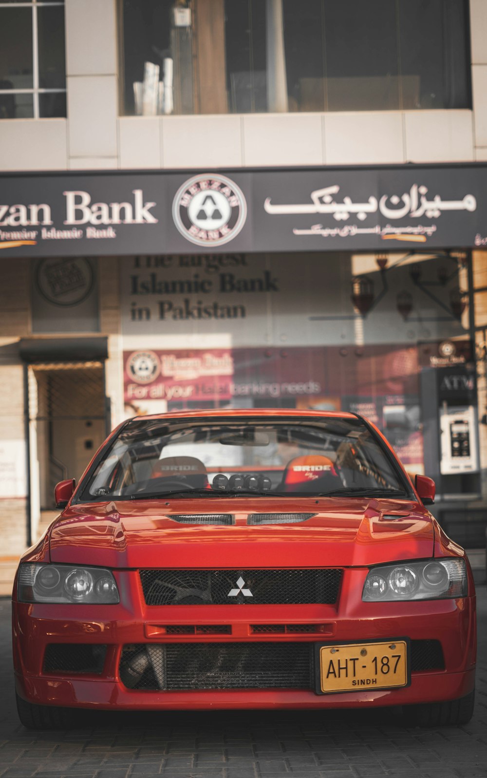 red bmw m 3 parked on street