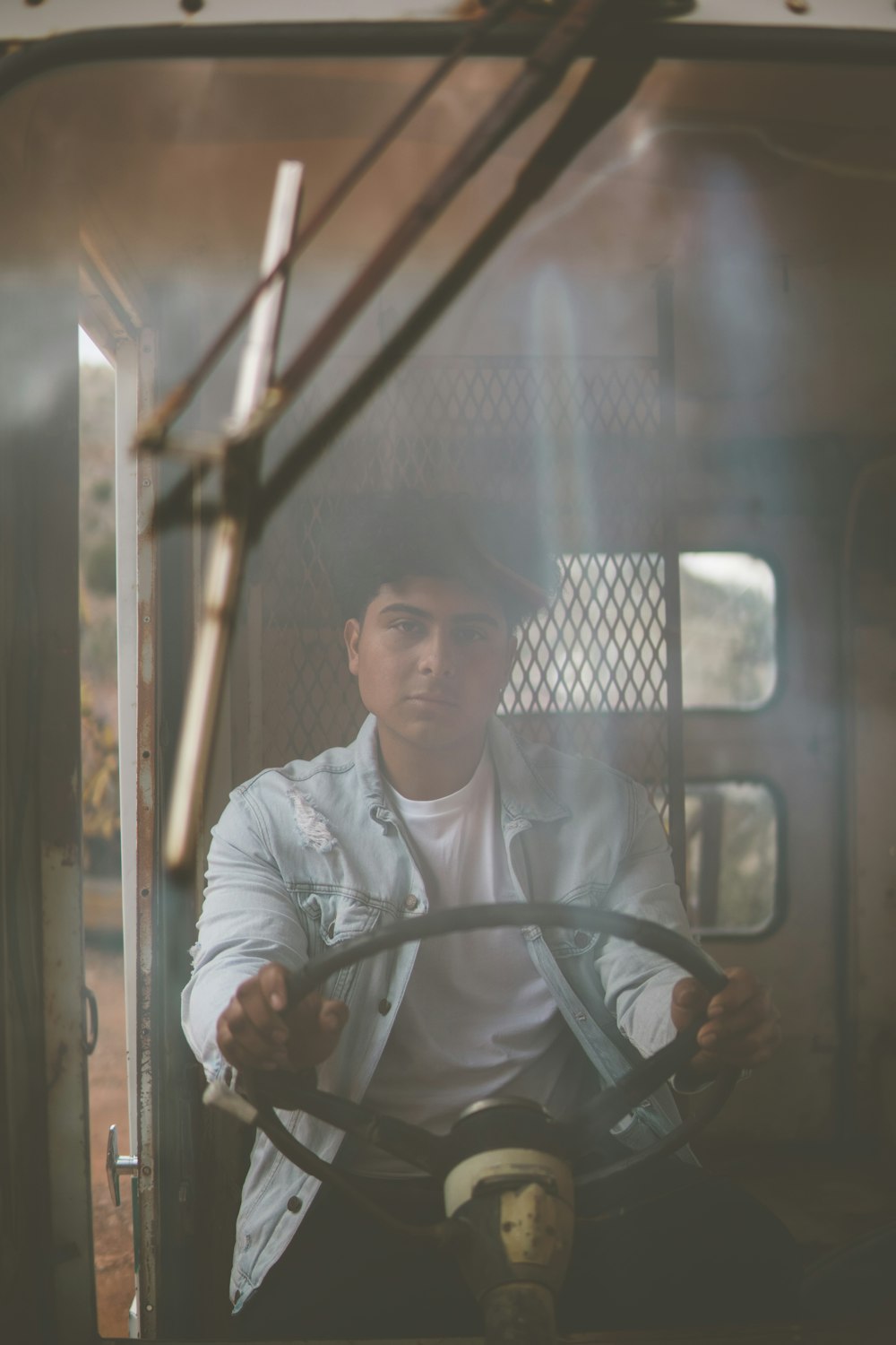 man in white dress shirt riding on vehicle