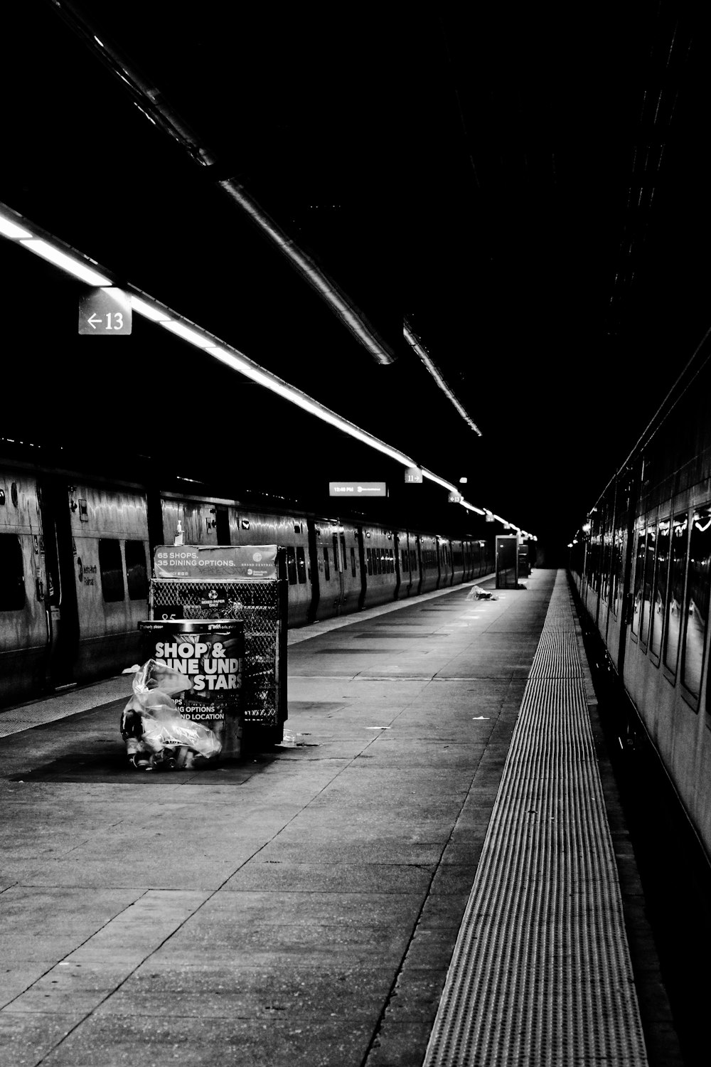 grayscale photo of a train station