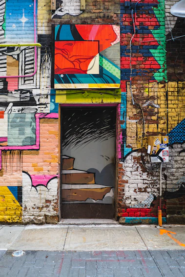 A vibrant urban mural blending Colombian street art with modern interior design elements.