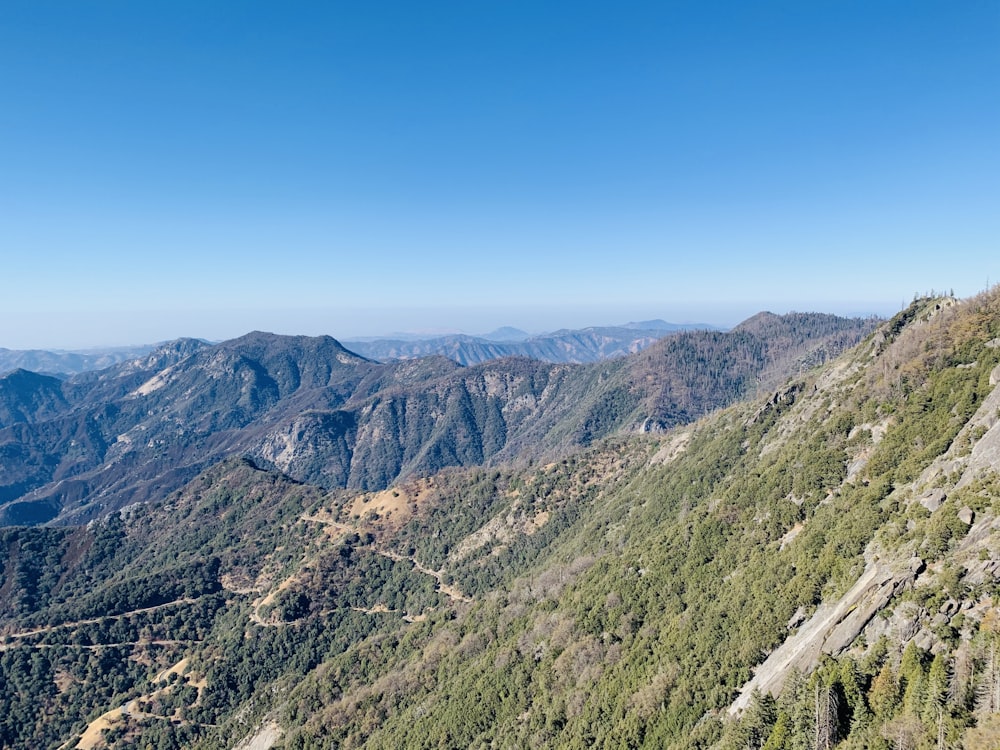 green and brown mountains under blue sky during daytime