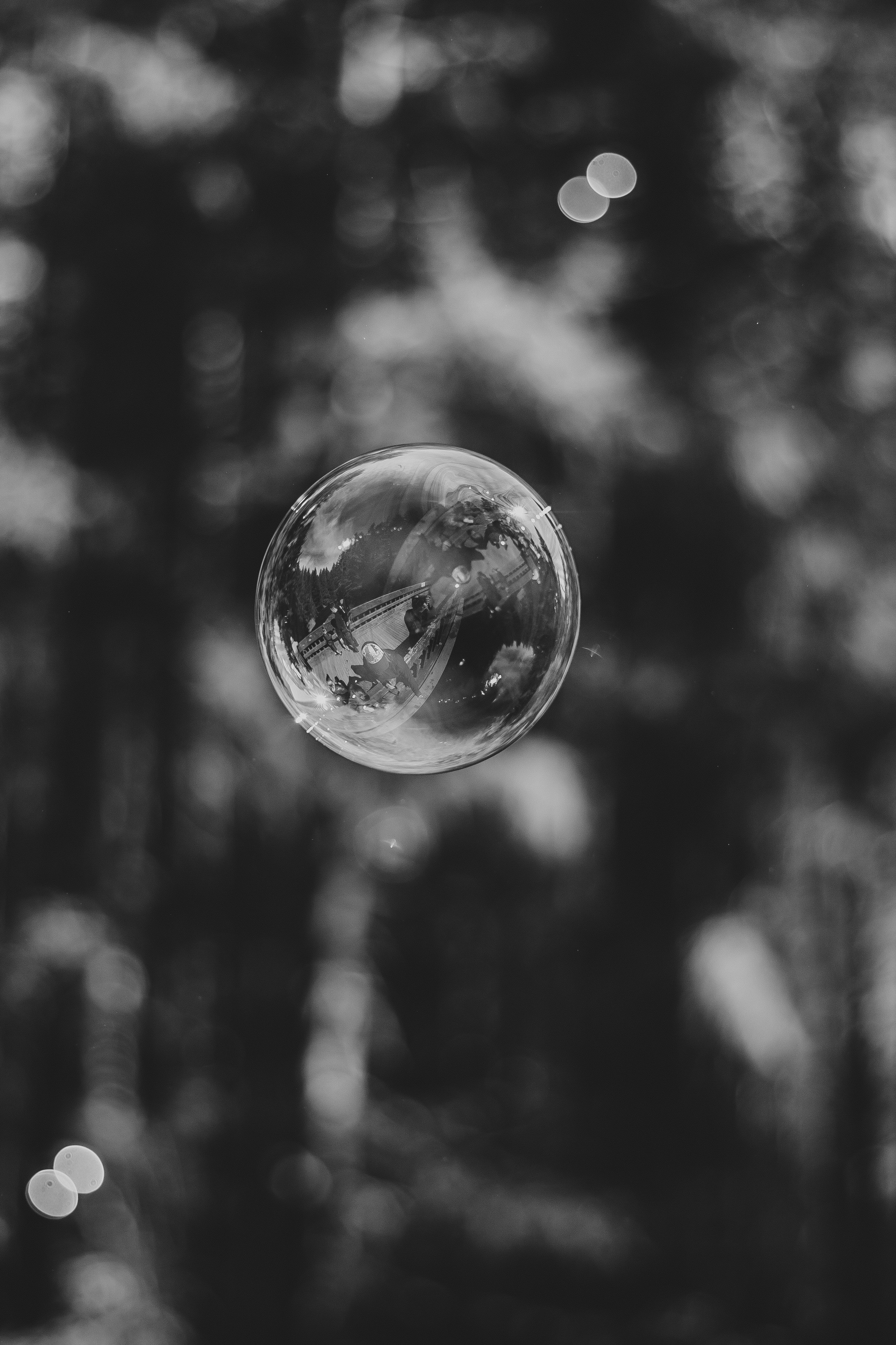 grayscale photo of bubble in mid air