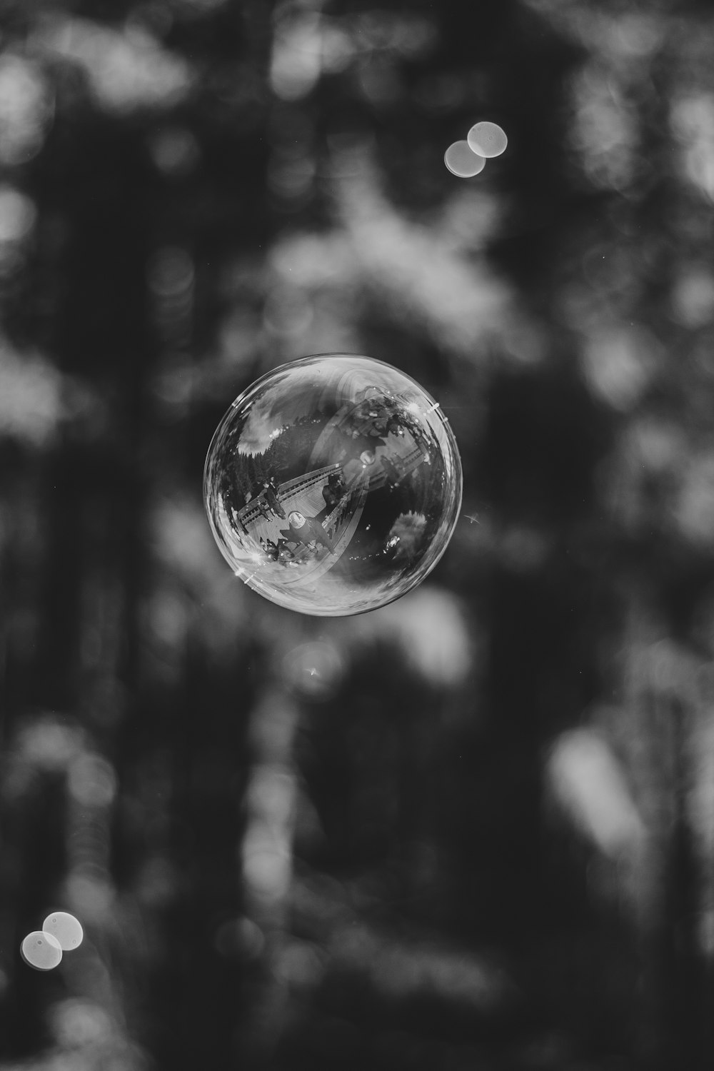 grayscale photo of bubble in mid air