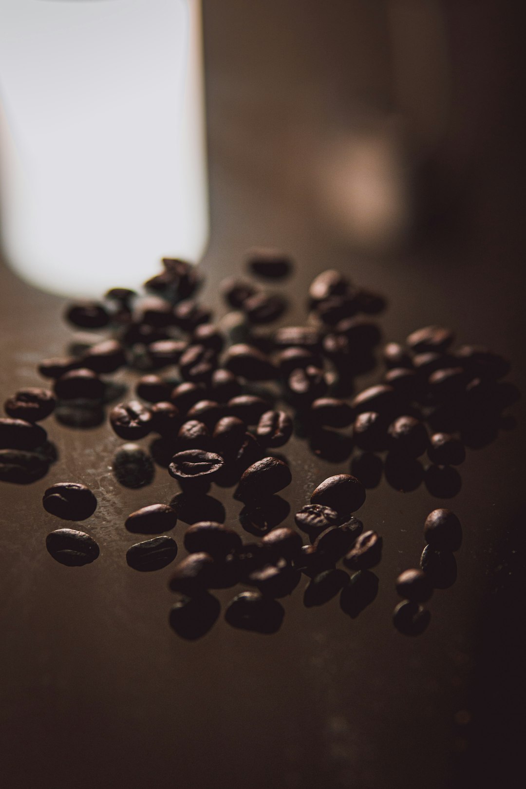 black coffee beans on brown wooden table