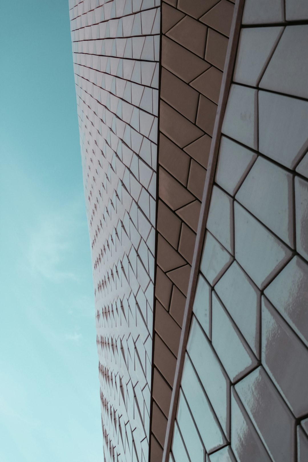 brown and white concrete building under blue sky during daytime