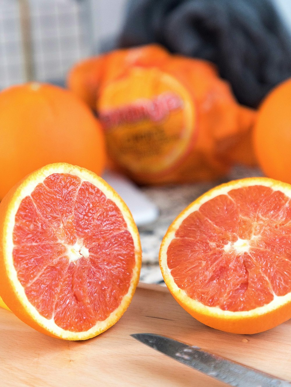 orange fruit on brown wooden table