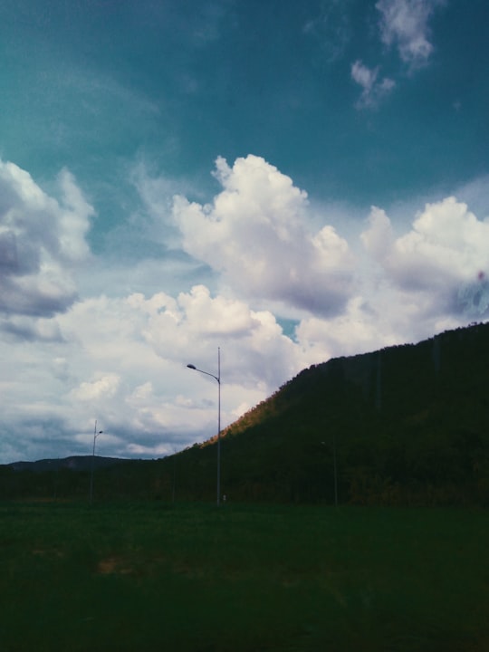 green grass field under blue sky and white clouds during daytime in Lajeado Brasil