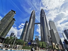 people walking on street near high rise buildings during daytime