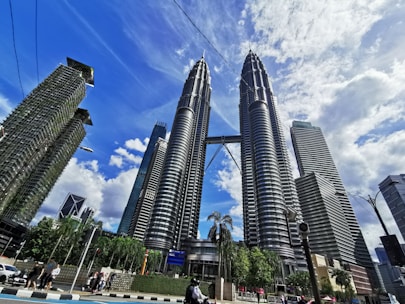 people walking on street near high rise buildings during daytime