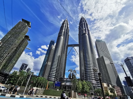 people walking on street near high rise buildings during daytime