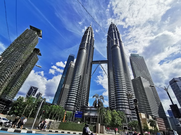 people walking on street near high rise buildings during daytime
