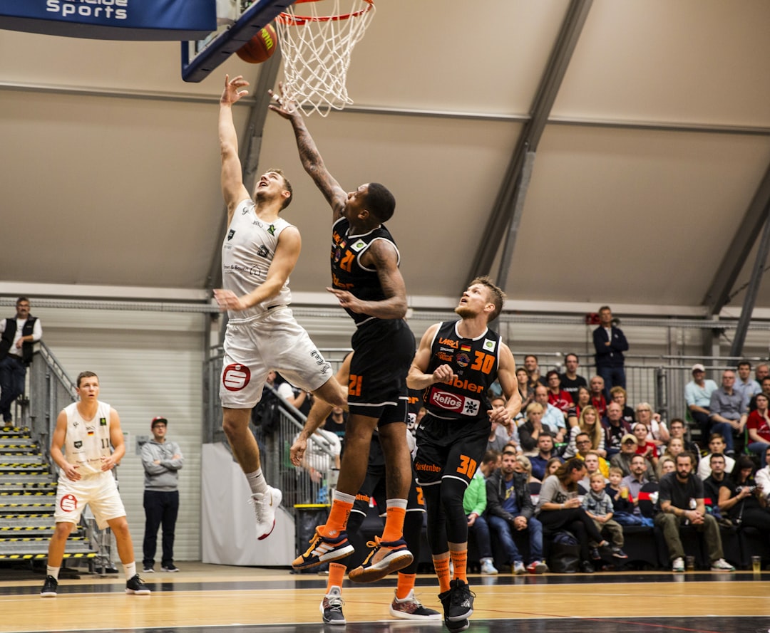 group of people playing basketball, Lay-up 2-points throw basketball match. Basketball – BARMER 2. Basketball Bundesliga