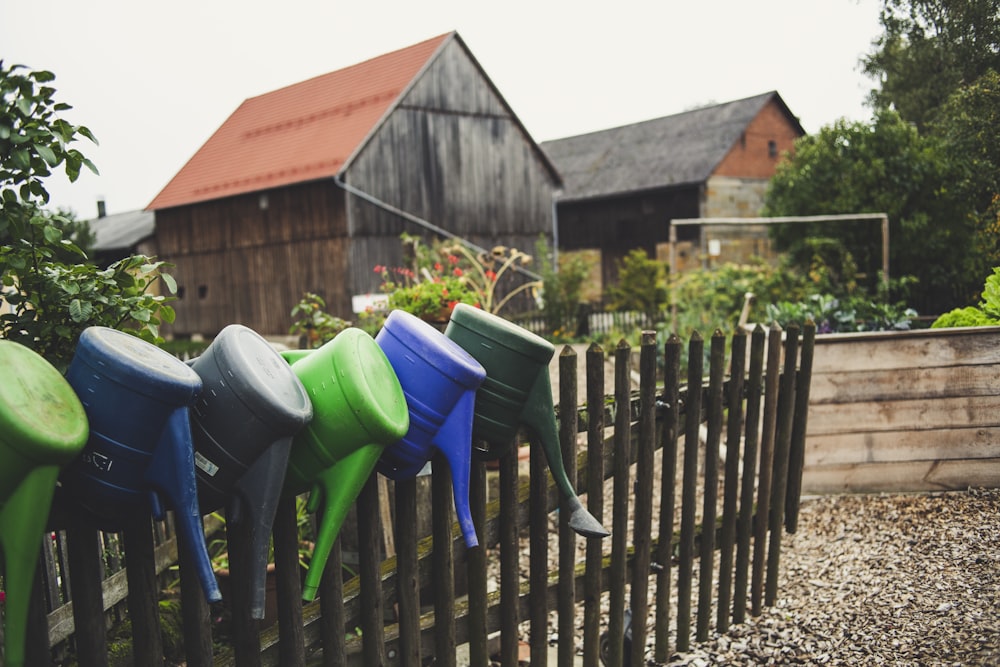 green blue and red plastic trash bins