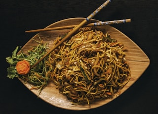 pasta dish on brown ceramic plate