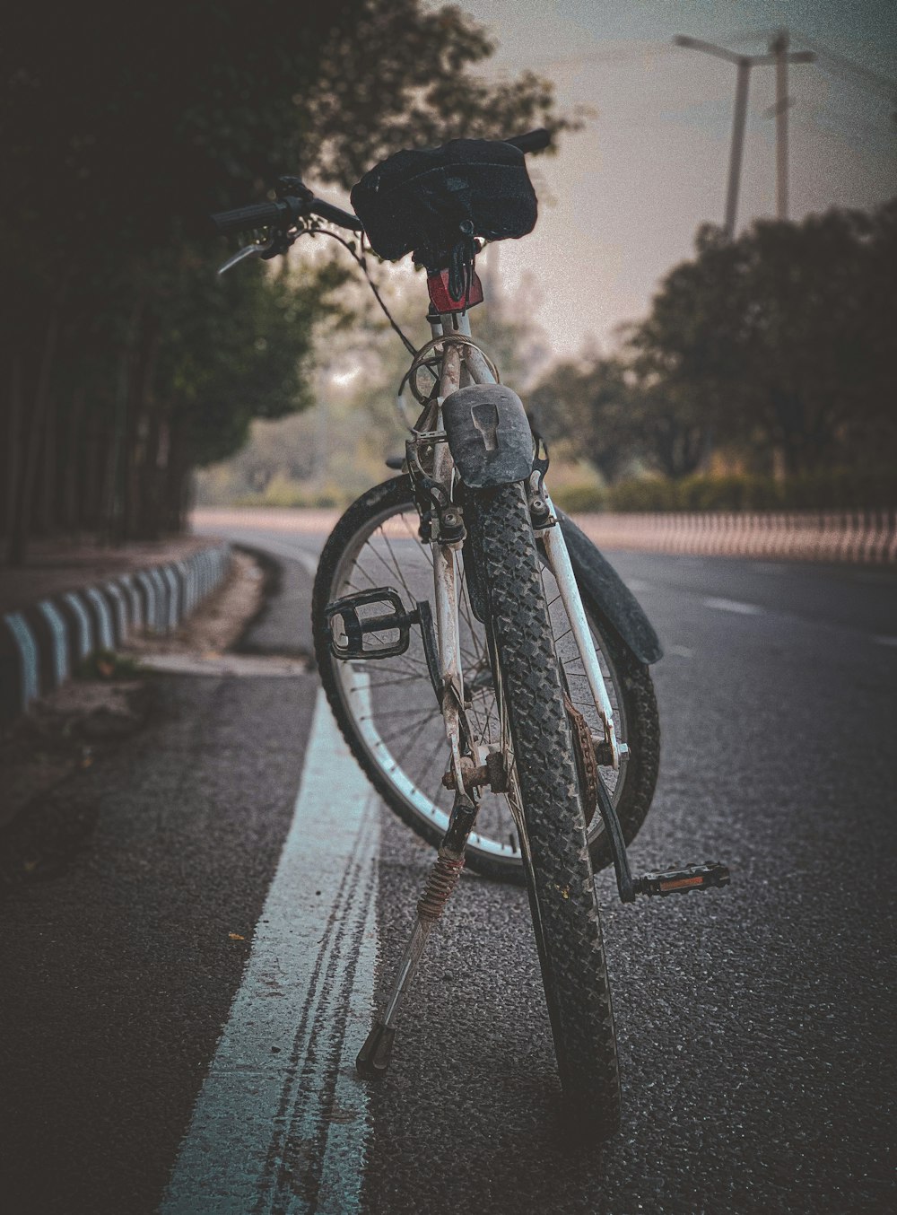 black bicycle on road during daytime