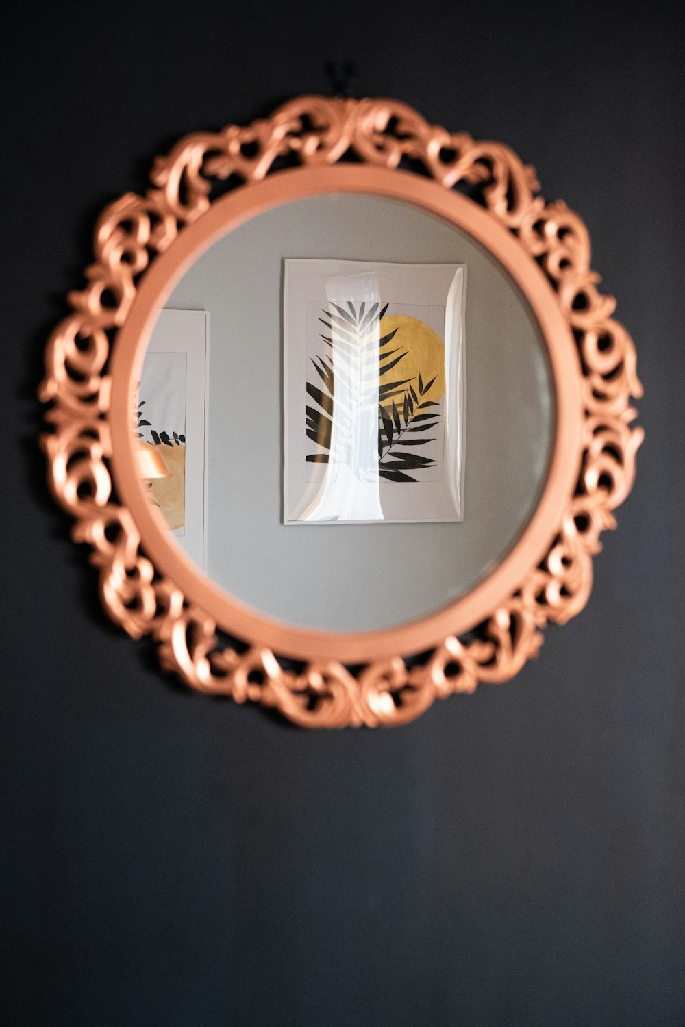 oval brown wooden framed mirror