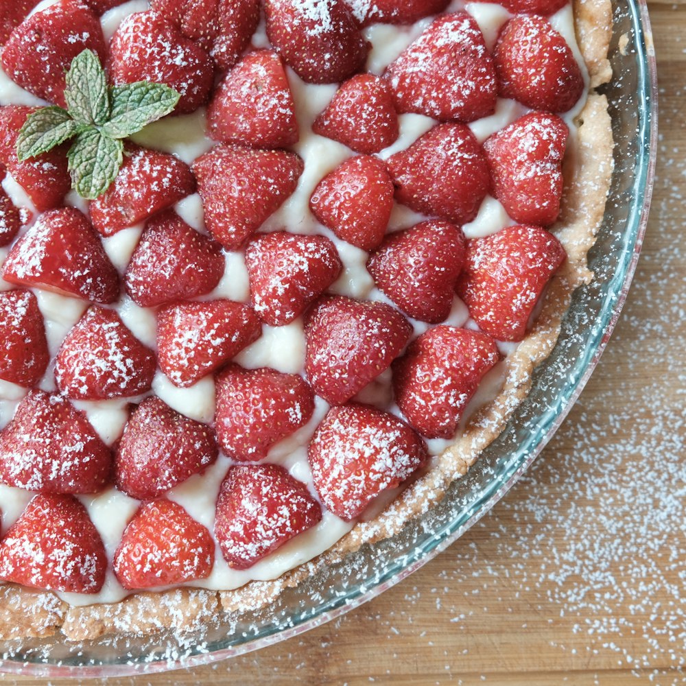 strawberries on clear glass bowl