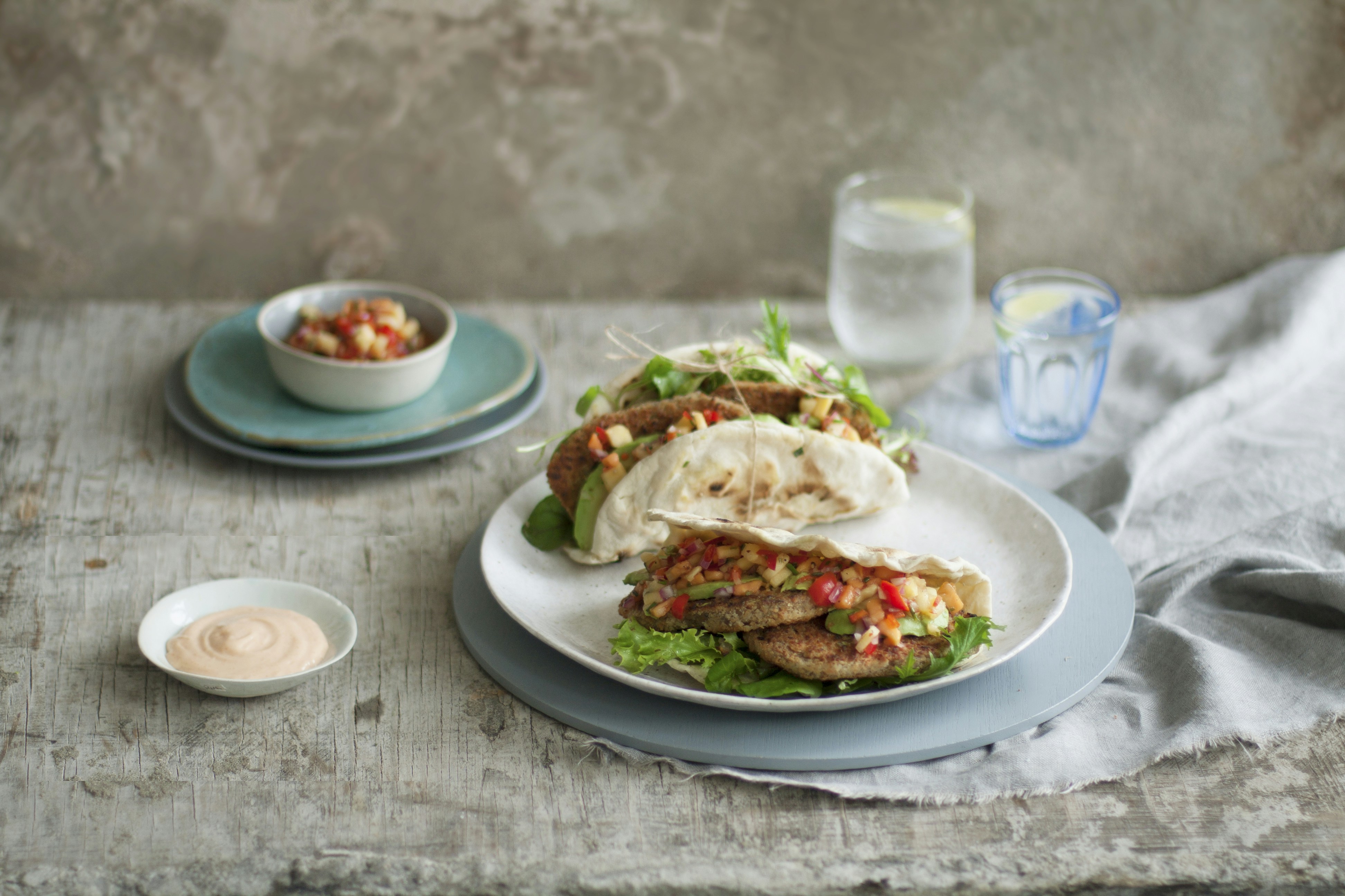 Wrap and dips on a white plate