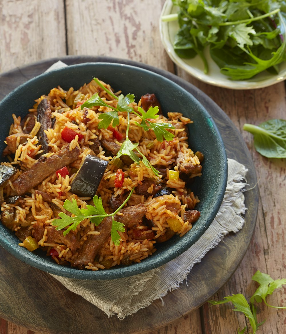 blue ceramic bowl with cooked food