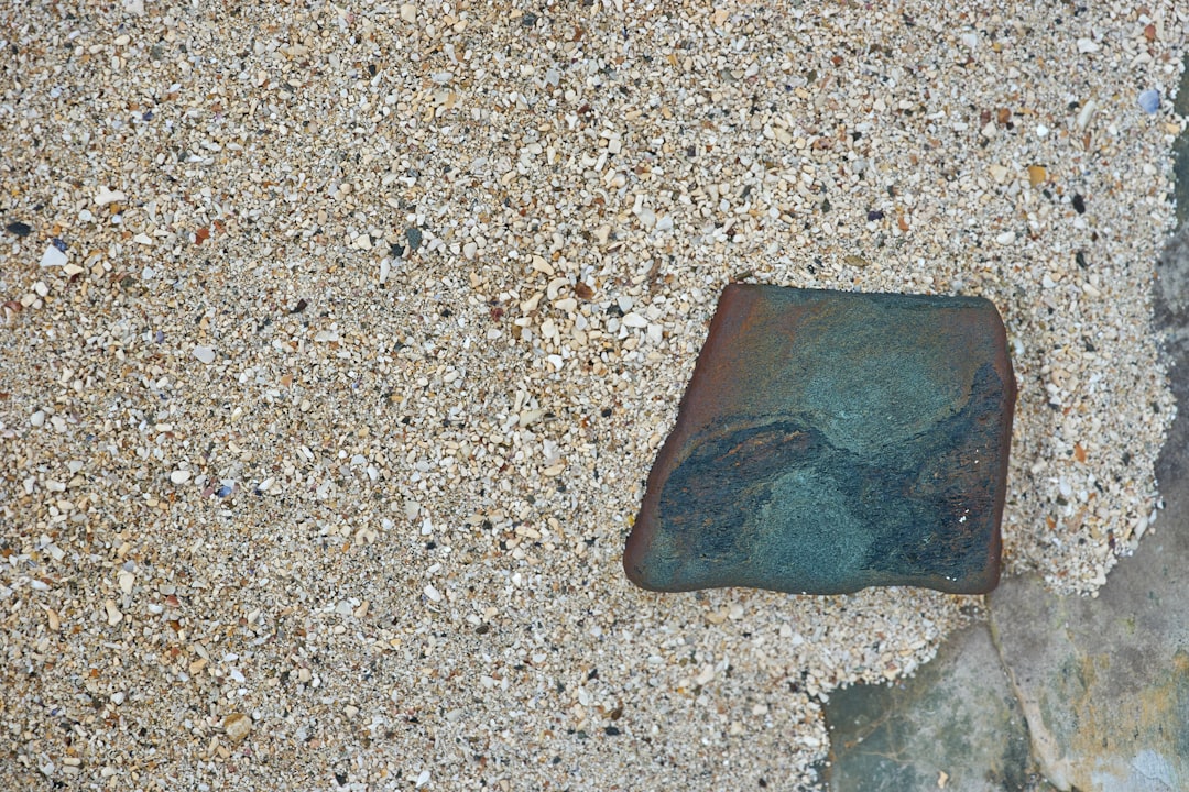brown stone on gray and white marble surface
