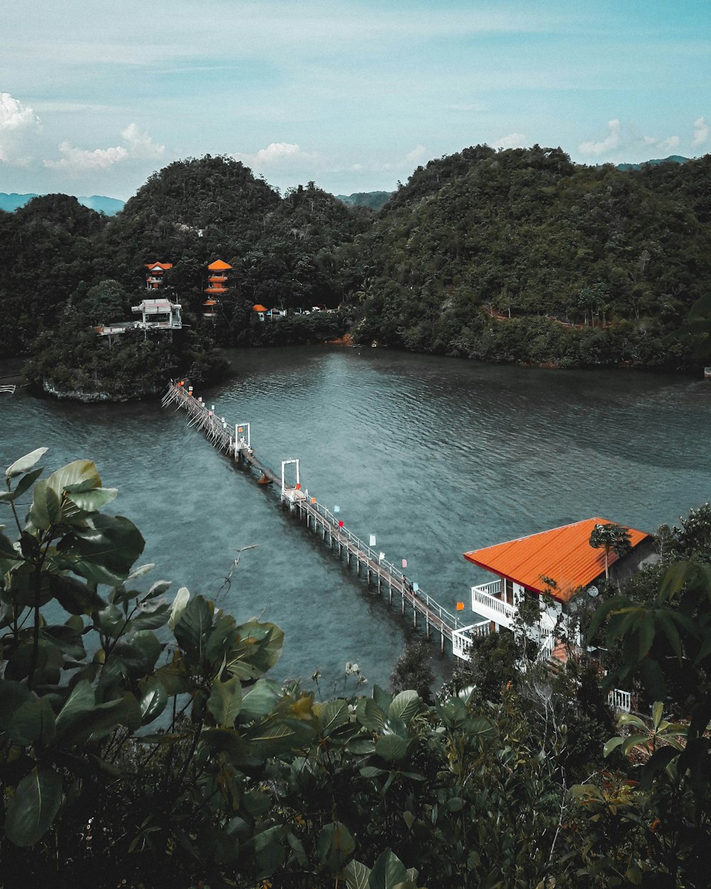 brown wooden dock on body of water during daytime