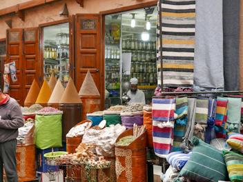 A bustling market in Marrakech filled with colorful textiles and spices.