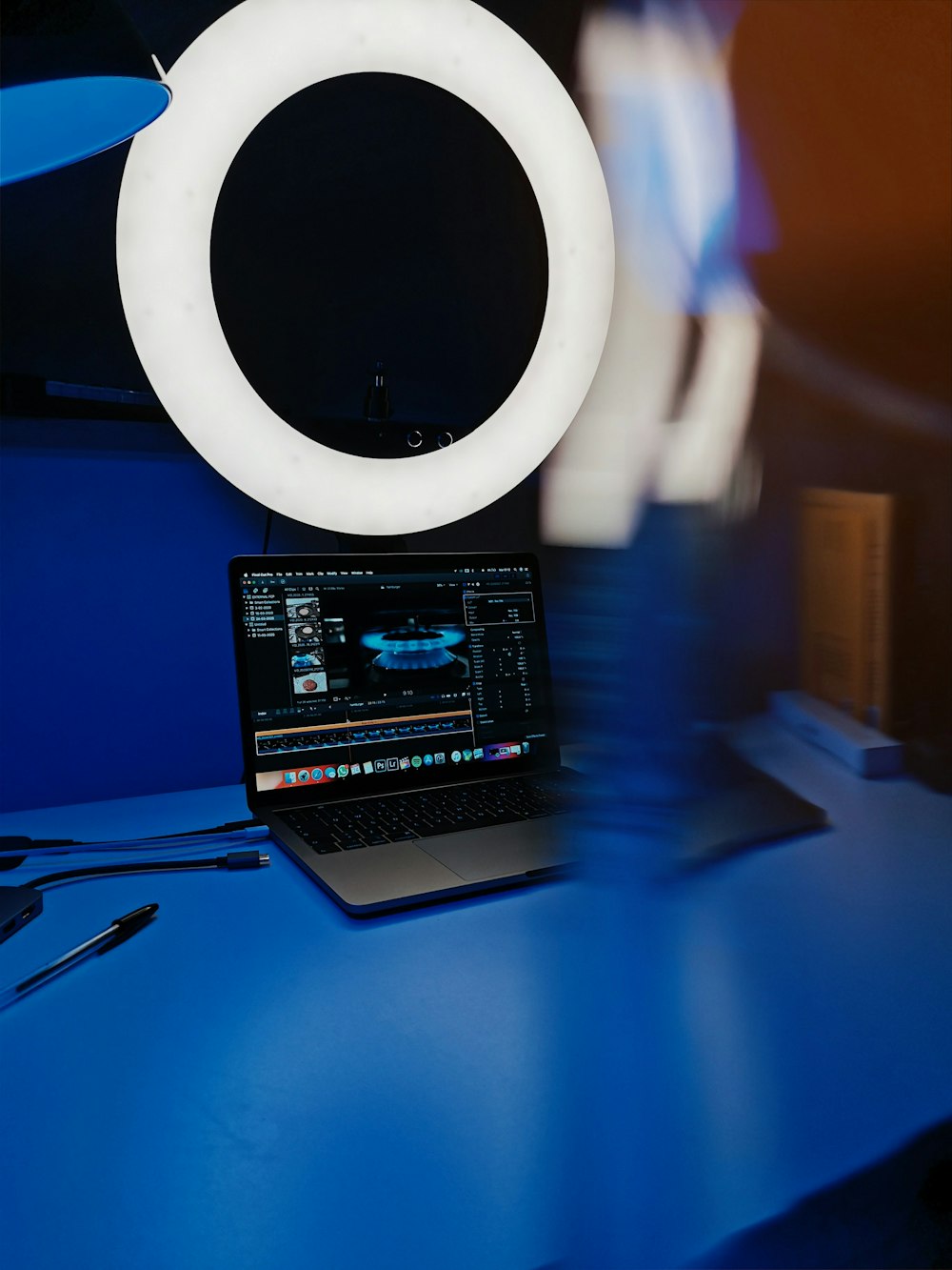 black and white laptop computer on blue table