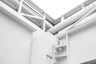 Close-up of a finely crafted wooden beam joint in a contemporary building.