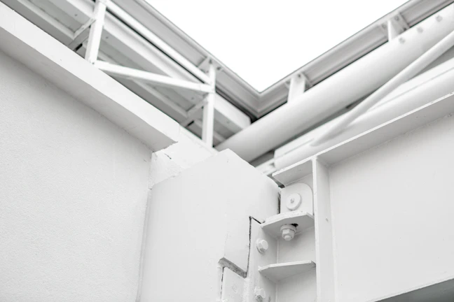 Architectural close-up showcasing clean lines and warm white facades.