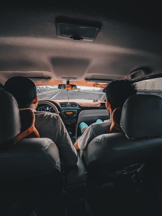 man in black shirt driving car in Al Ain - Abu Dhabi - United Arab Emirates United Arab Emirates