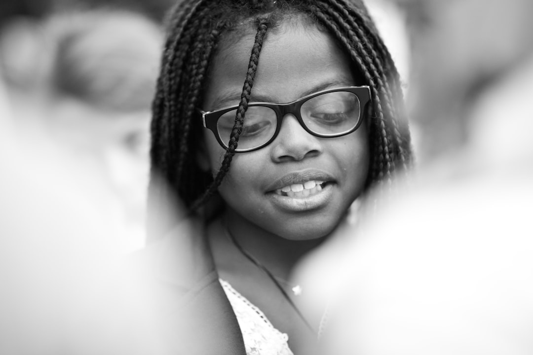 woman wearing black framed eyeglasses