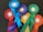 A collection of colorful award ribbons, each labeled as a winner. The ribbons are of various colors including red, blue, purple, green, yellow, and orange, arranged on a dark surface. Each ribbon is marked with different event names such as 'Conaccord Stakes' and 'The Sand Race'.