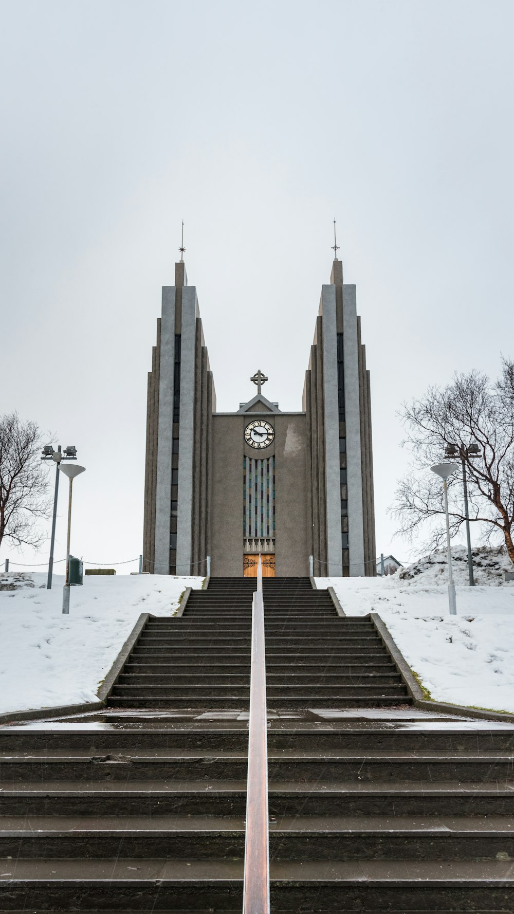 gray concrete building with snow covered ground