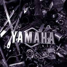 a pile of metal parts with the word yamaha on them