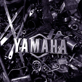 a pile of metal parts with the word yamaha on them