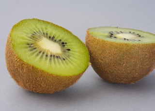 sliced green fruit on white surface