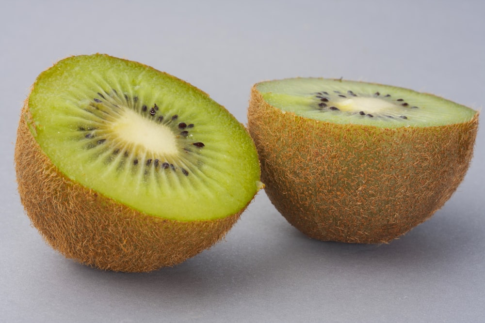 sliced green fruit on white surface