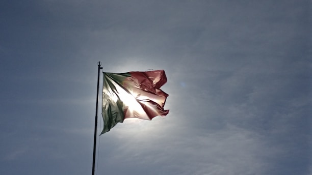 Close-up image of a windbanner fluttering outside in bright sunlight.