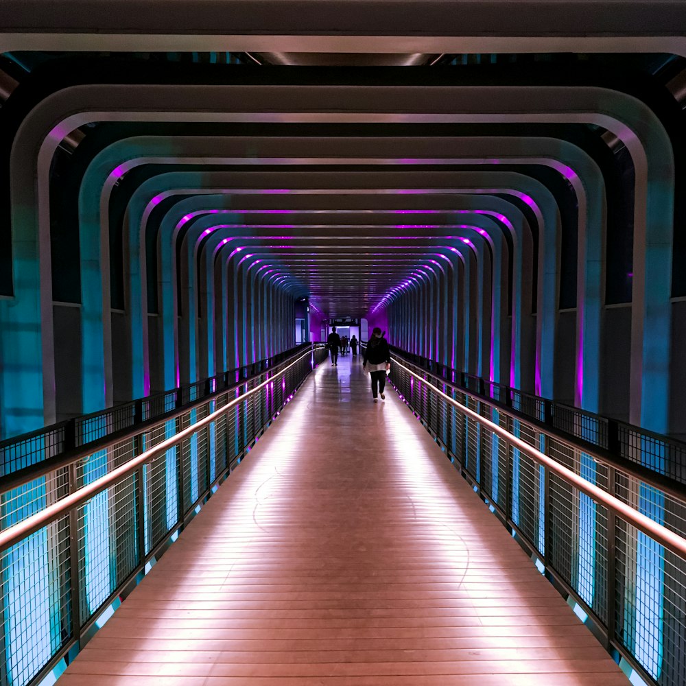 brown wooden hallway with blue and white lights