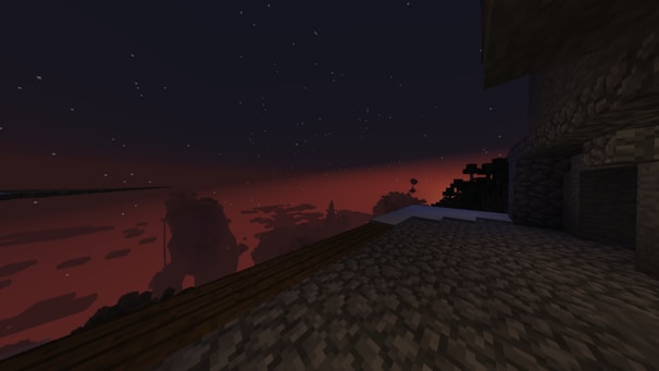 A vibrant Minecraft landscape showing a peaceful village at sunset.