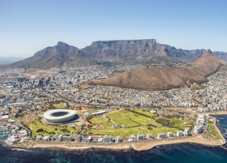 aerial view of city near mountain during daytime