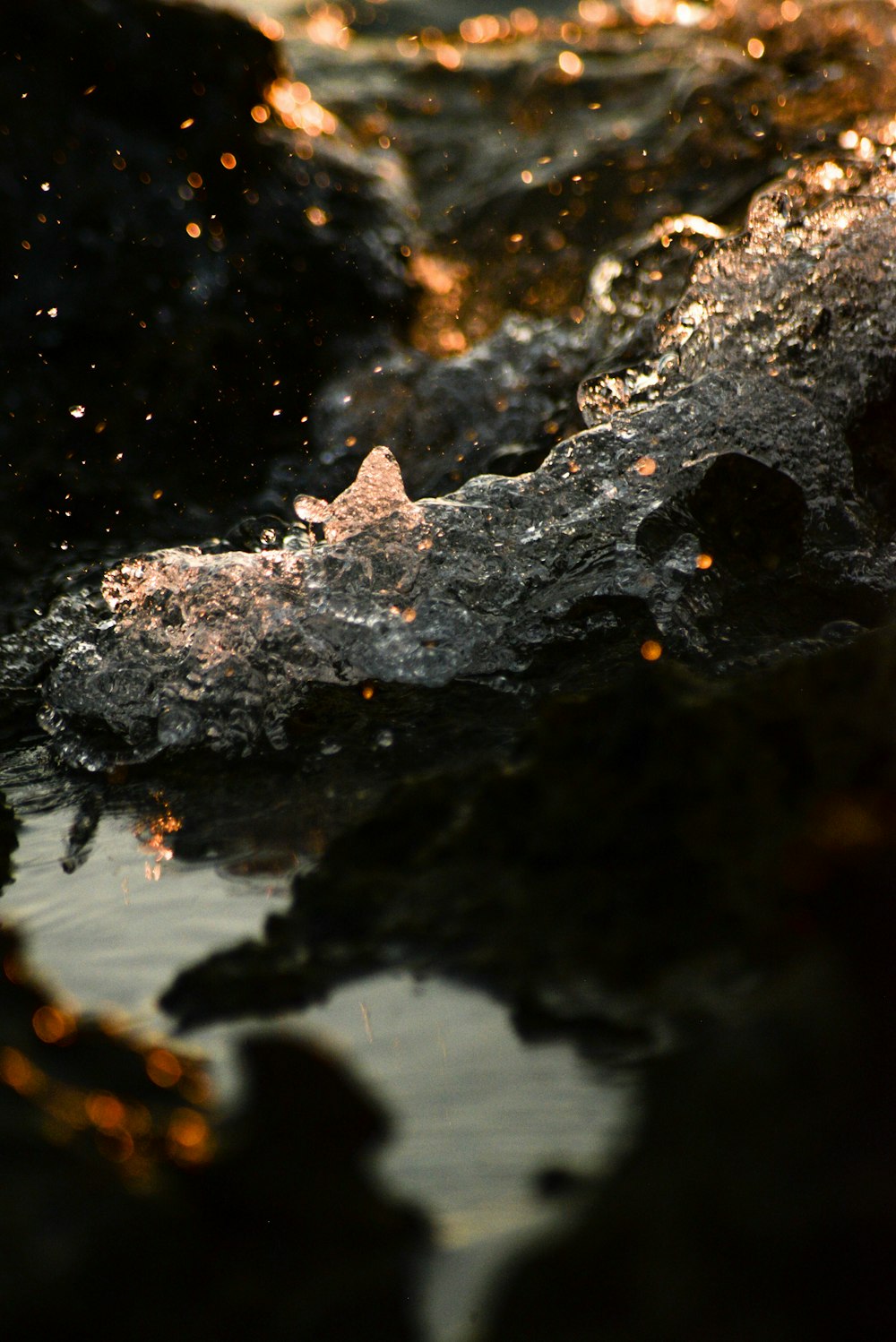 water splash on black rock