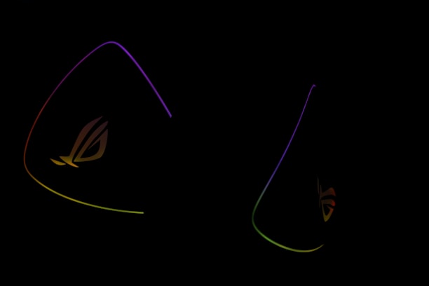 Dark background is highlighted by glowing outlines of colorful triangular shapes with the letters 'ROG' subtly visible, suggesting a gaming or tech-related theme.