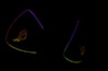 Dark background is highlighted by glowing outlines of colorful triangular shapes with the letters 'ROG' subtly visible, suggesting a gaming or tech-related theme.