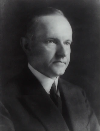 A professional portrait of a lawyer in a suit.